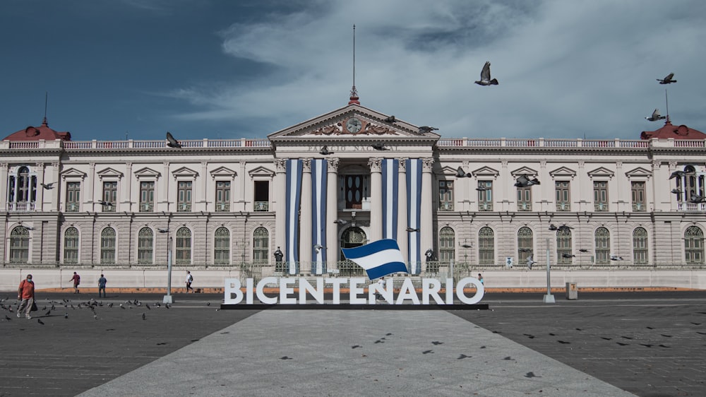 a large building with a flag in front of it