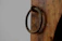 Close-up of a rustic wooden door handle mounted on a cozy home door.