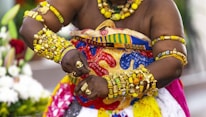 a woman dressed in a colorful costume and jewelry
