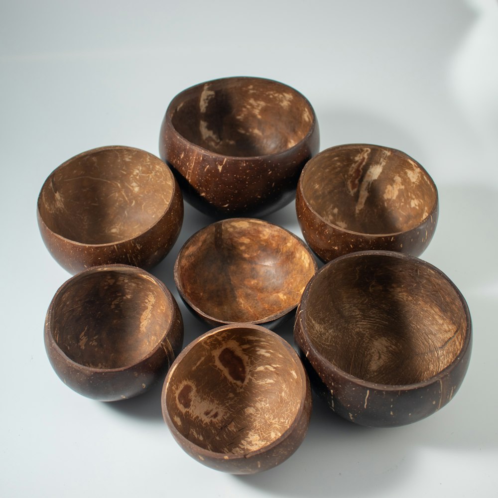 a group of wooden bowls sitting on top of a table