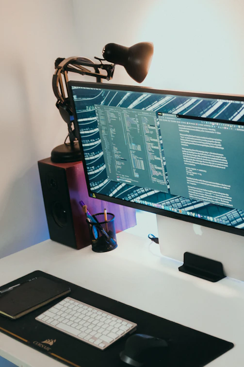 a computer monitor sitting on top of a desk