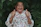 an old woman giving a thumbs up sign