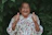an old woman giving a thumbs up sign
