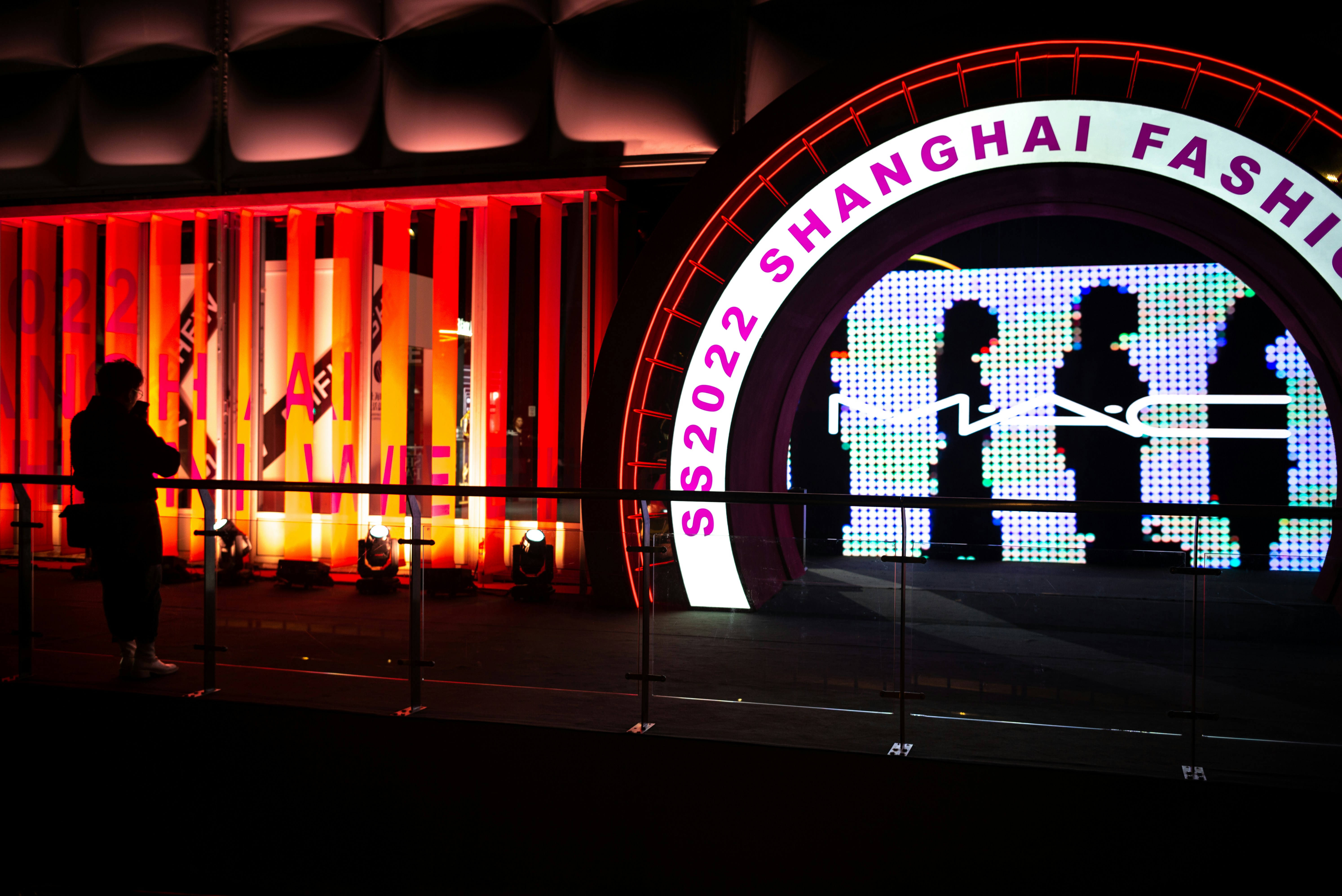 Awards ceremony stage with trophy and spotlight