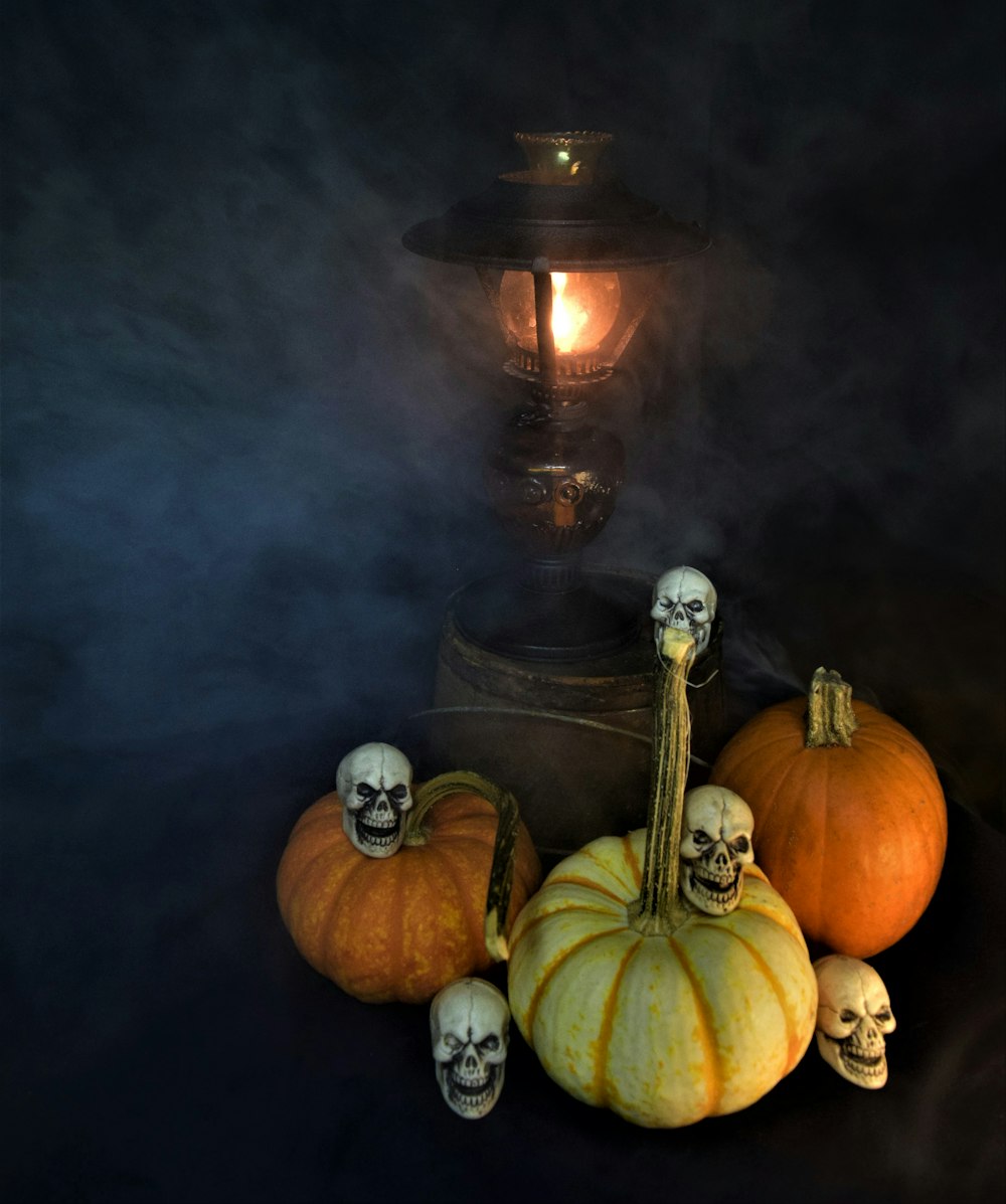 a group of pumpkins with skulls on them