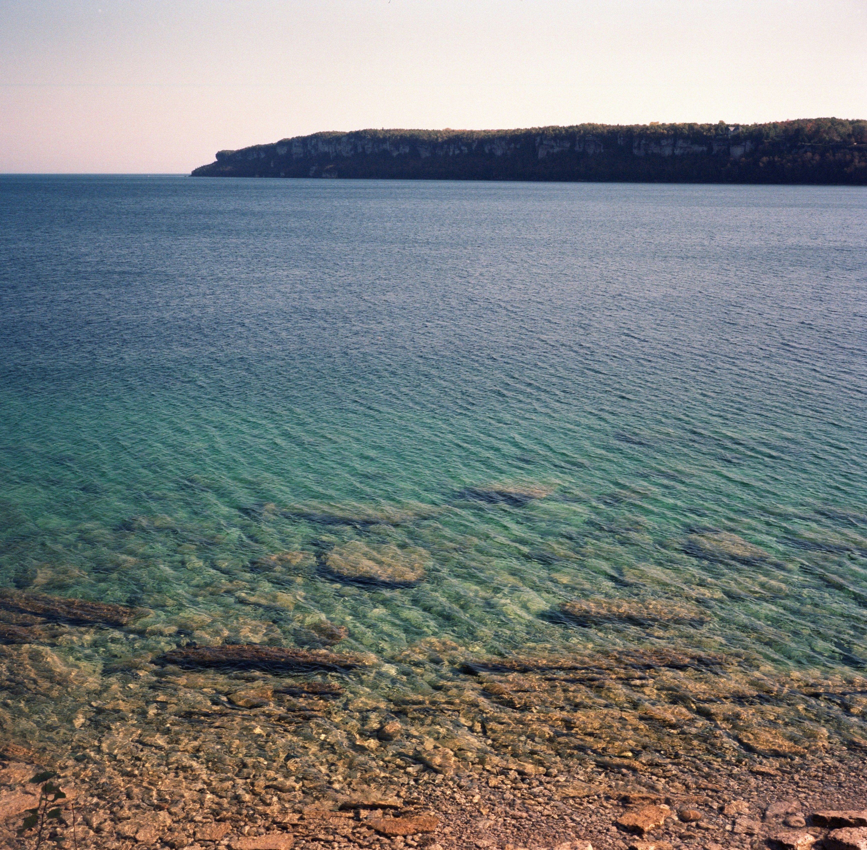 a body of water with rocks in it