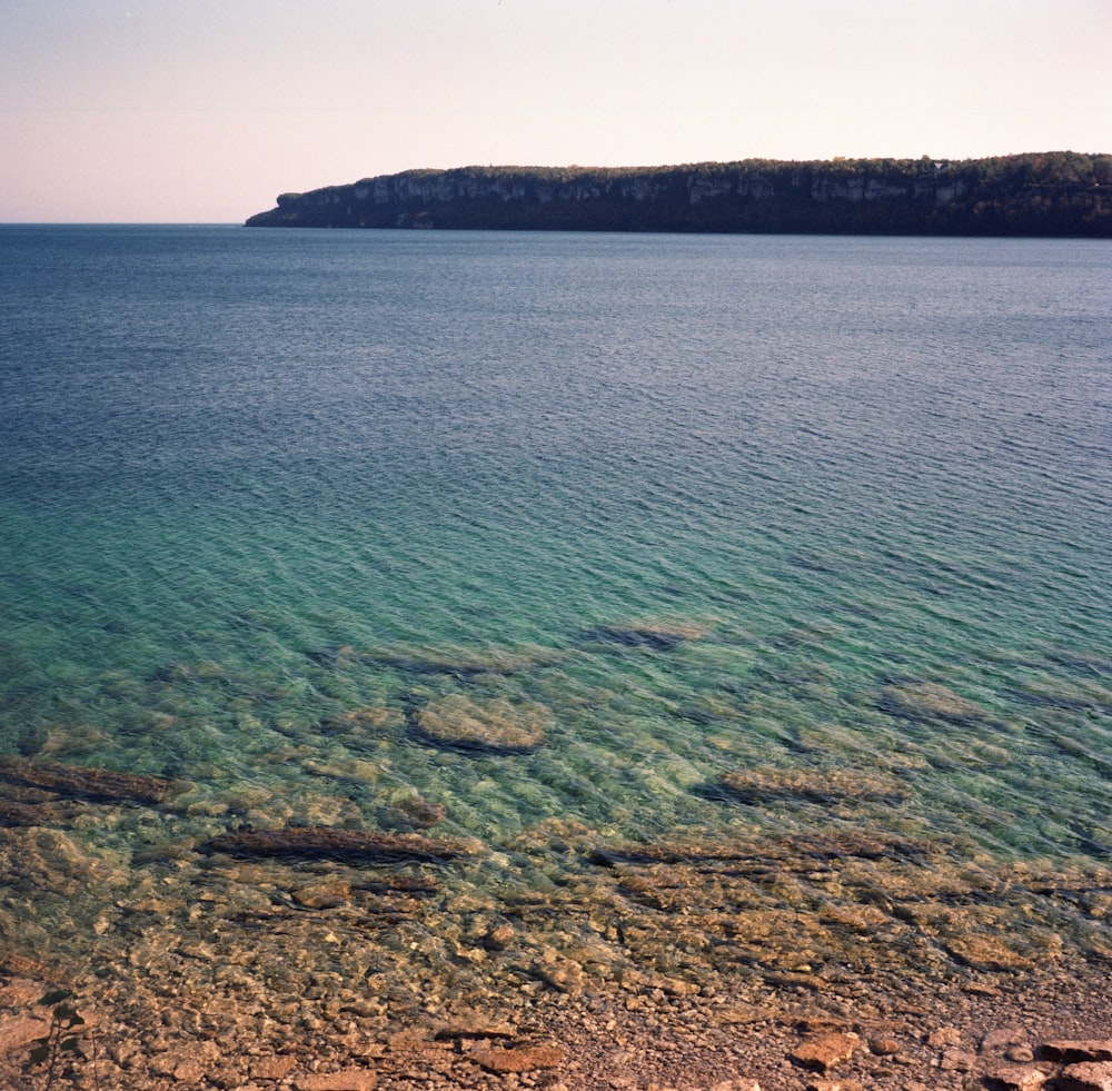 a body of water with rocks in it