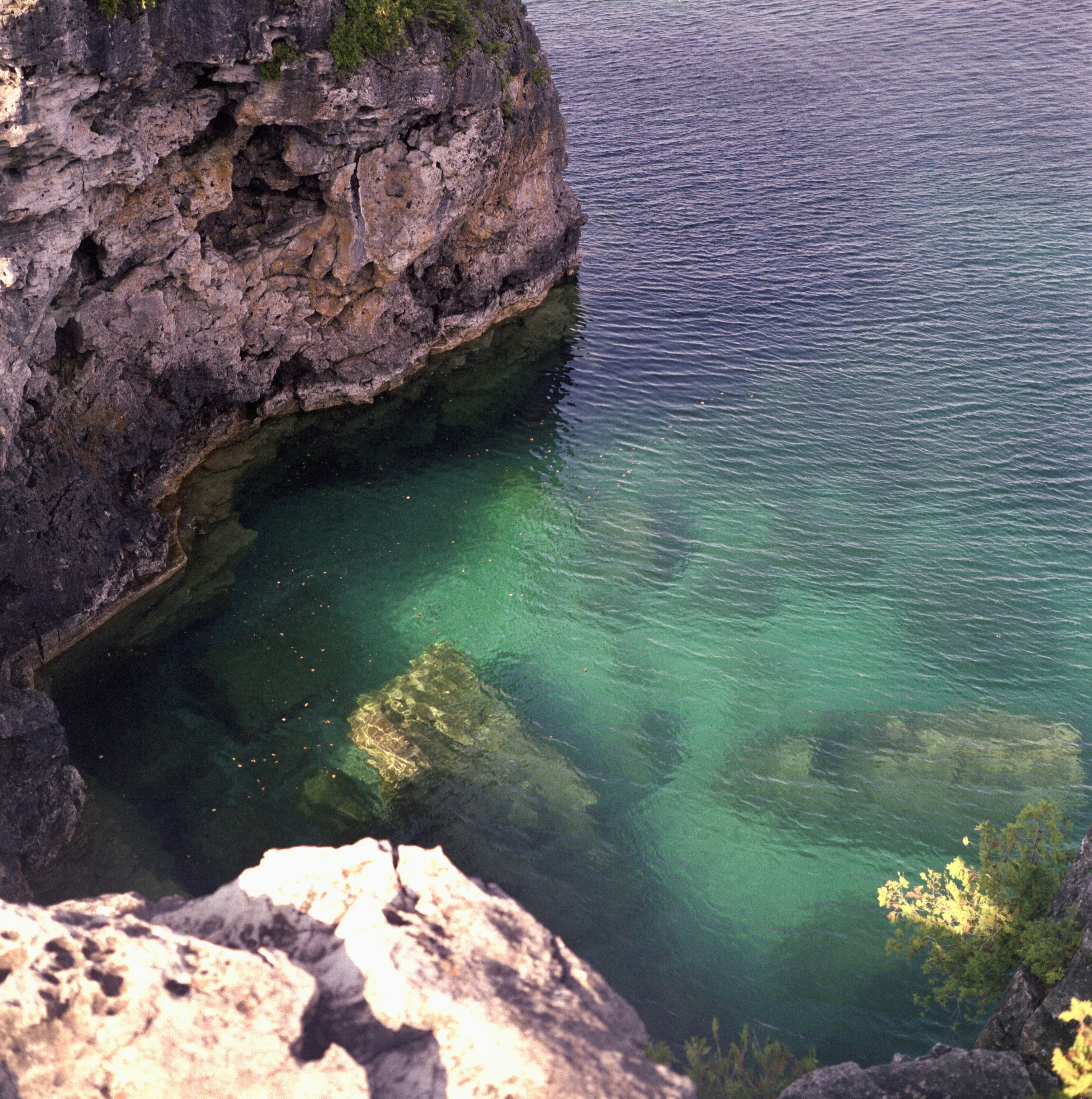 a large body of water surrounded by rocks
