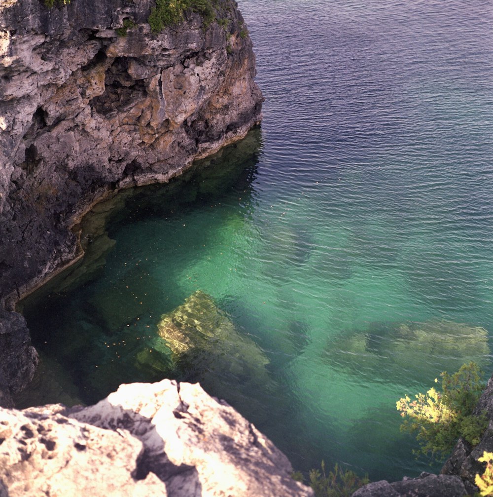 a large body of water surrounded by rocks