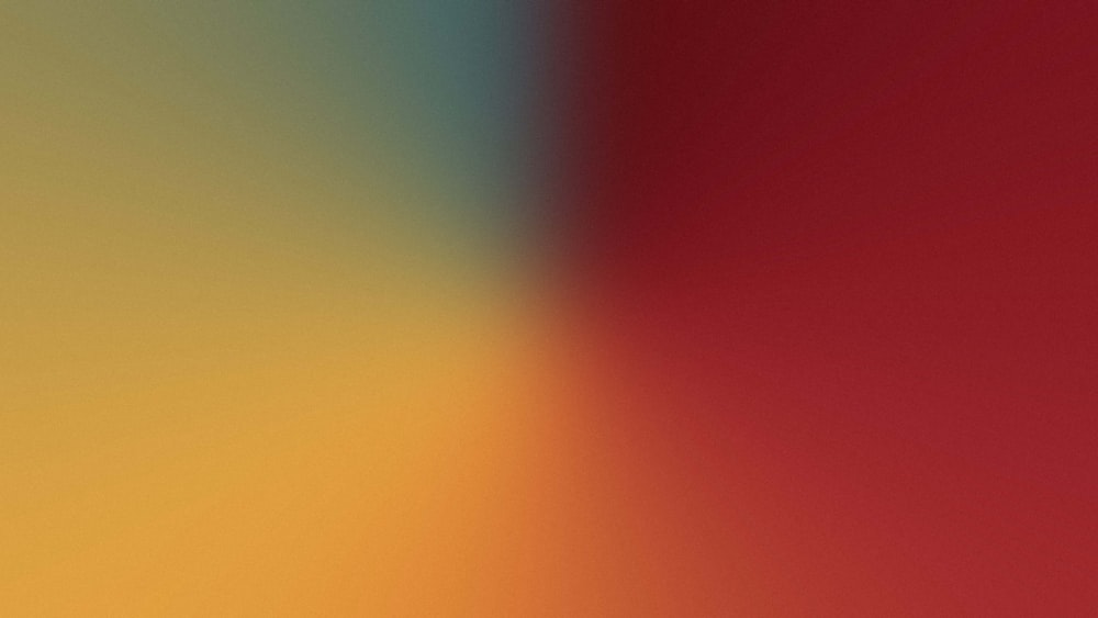 a close up of a red and yellow background