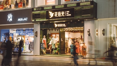 A vibrant street scene with models wearing Lumina Apparel pieces, blending style and movement.