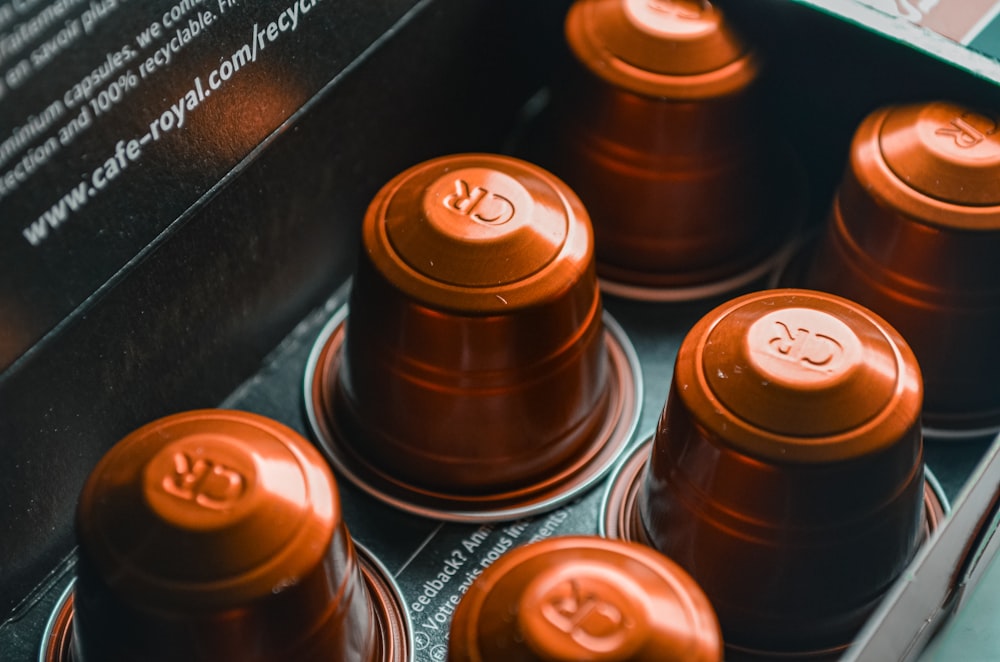 a close up of a box of spools of thread