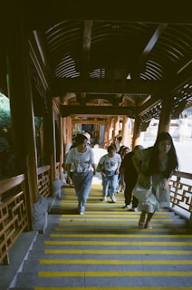 A group of learners engaged in a challenge ladder, their faces lit with determination and friendly competition.