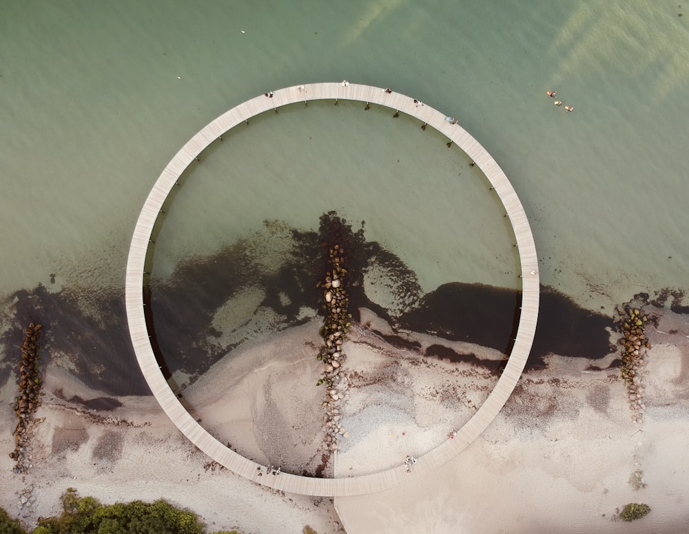 an aerial view of a circular object in the water
