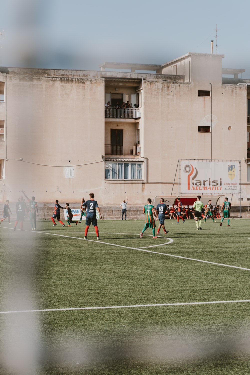 a group of people playing a game of soccer