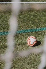 a soccer ball sitting on top of a soccer field