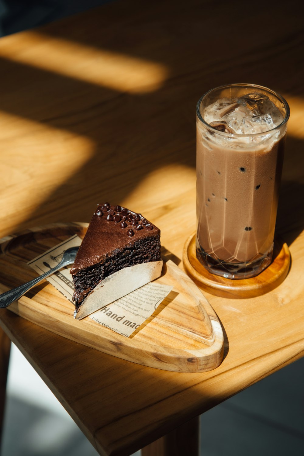 a piece of cake and a drink on a table