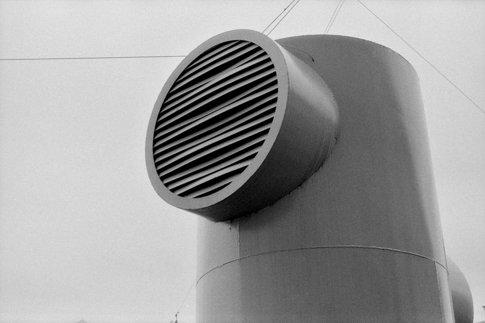 a black and white photo of a large metal object