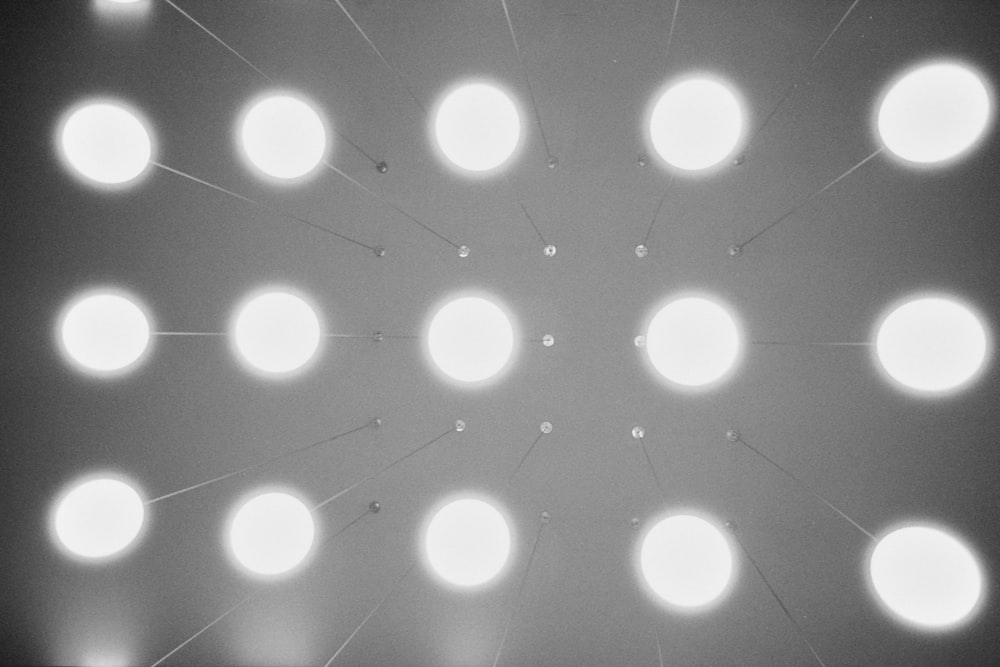a black and white photo of a ceiling with lights