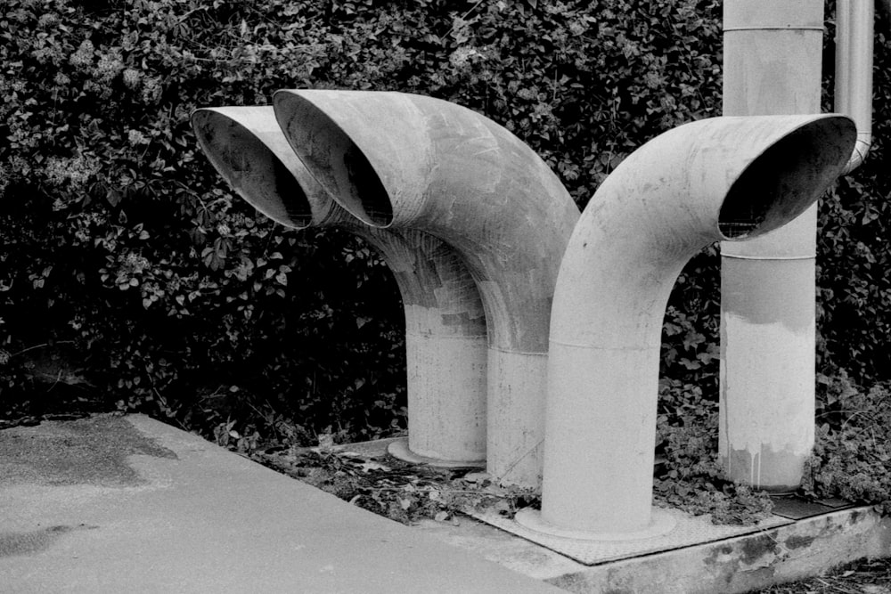 a black and white photo of a couple of pipes