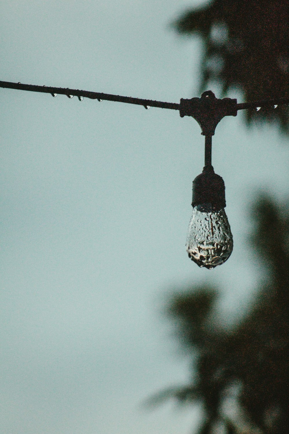 a light bulb is hanging from a wire