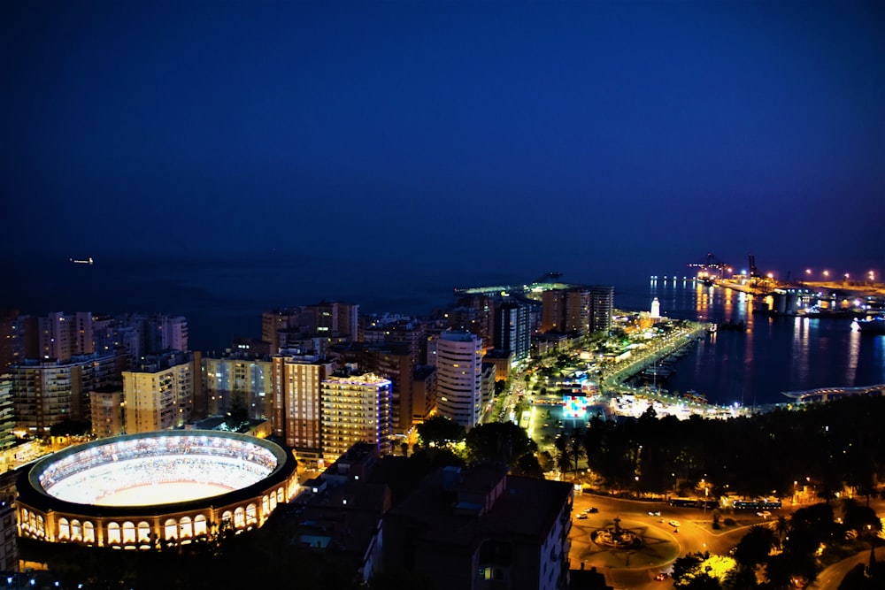 a night view of a city and a body of water