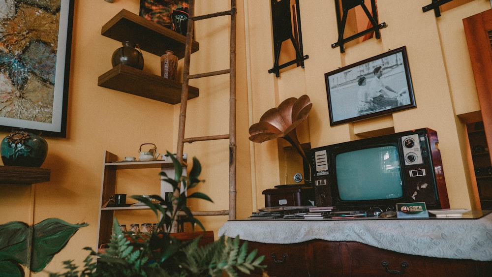 a television sitting on top of a wooden table