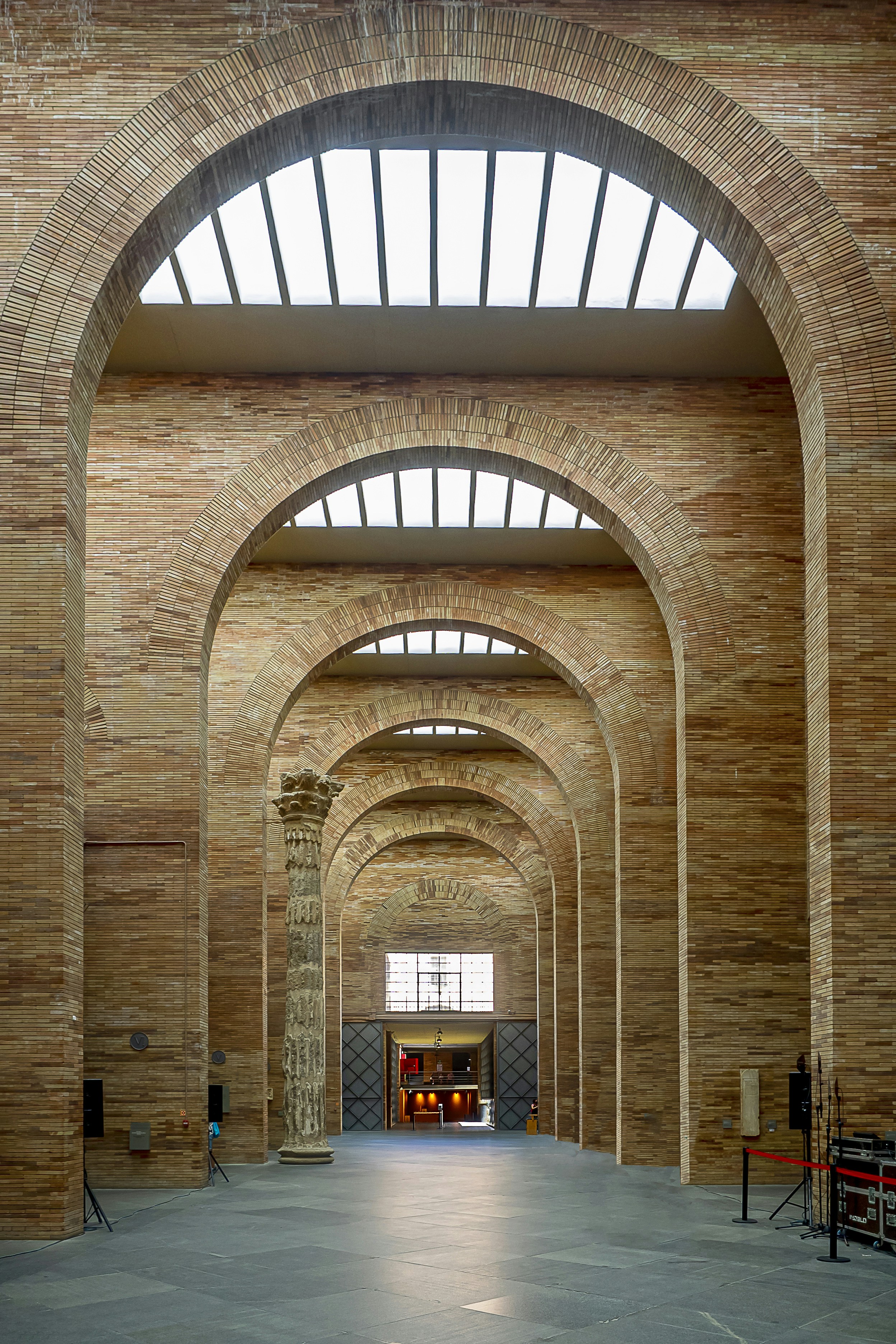 A large brick building with a large arched doorway photo – Free Brown ...
