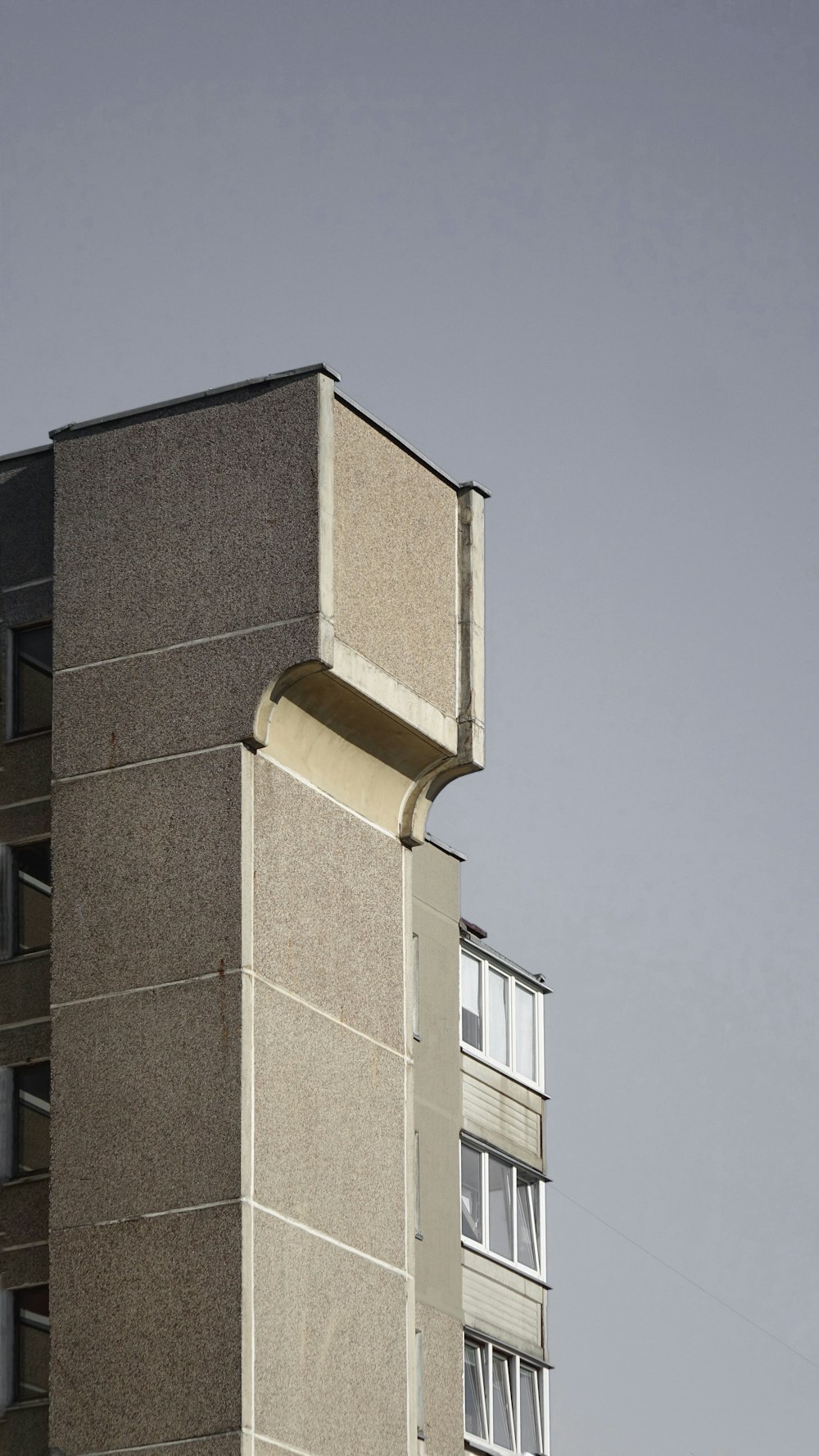 a tall building with a clock on the top of it