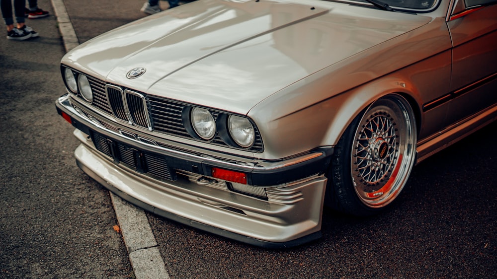 a silver car parked on the side of the road