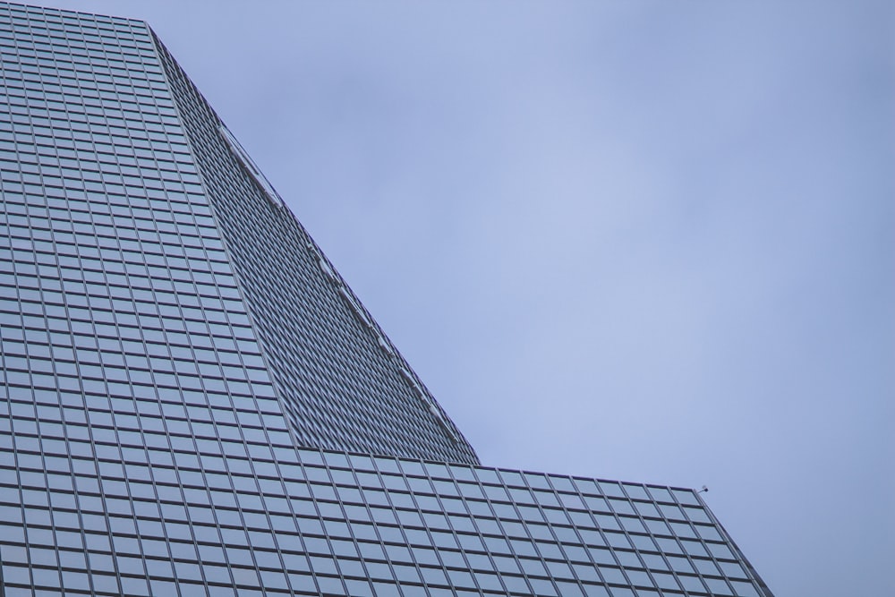 a very tall building with a clock on it's side