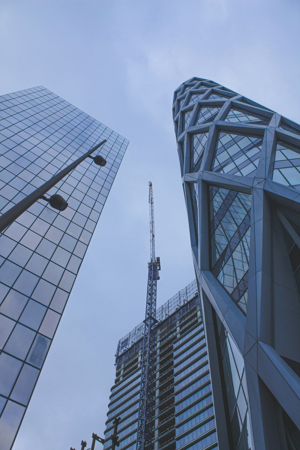 two tall buildings next to each other in a city