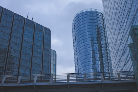 a couple of tall buildings sitting next to each other