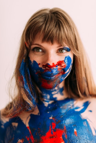 a woman with blue and red paint on her body