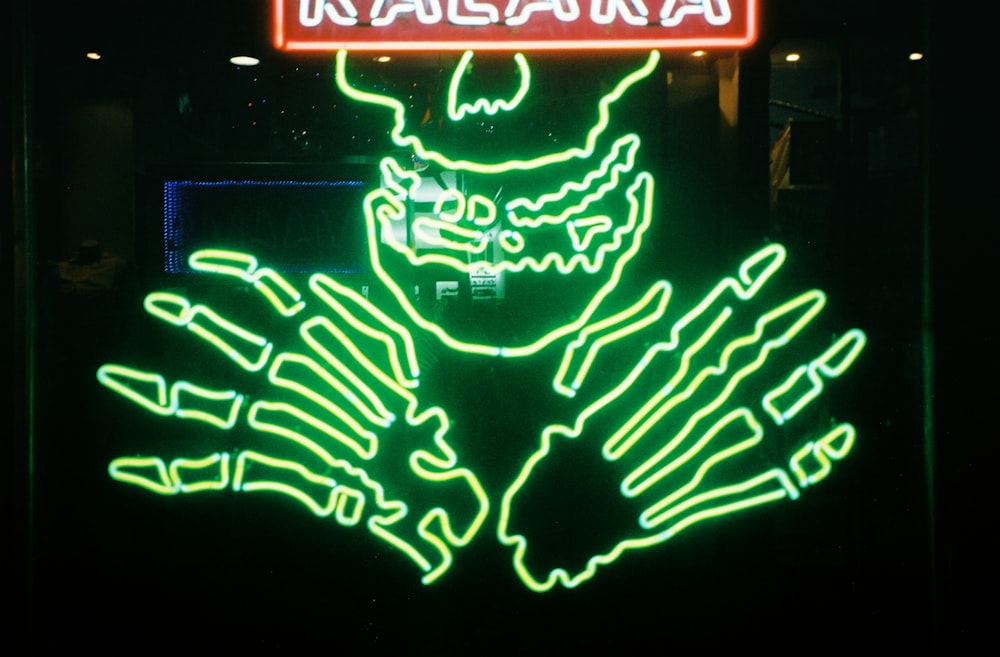 a neon sign with a skeleton on it