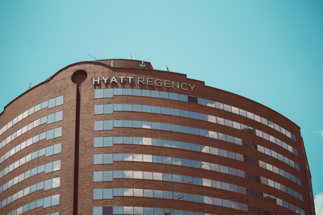a tall building with a sky background, Reflections in hotel windows.