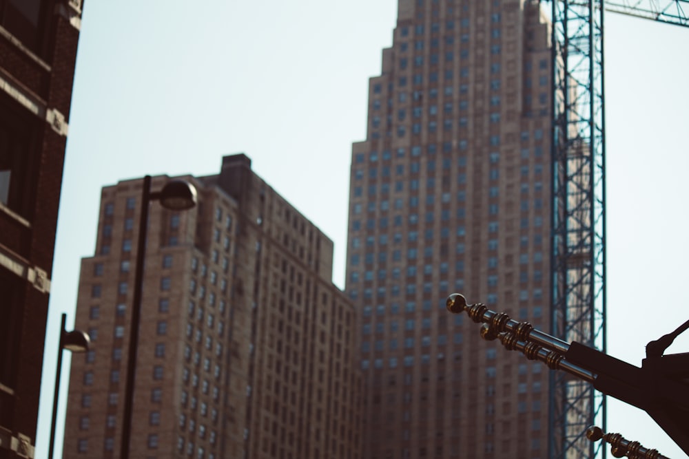 a close up of a musical instrument in front of a building