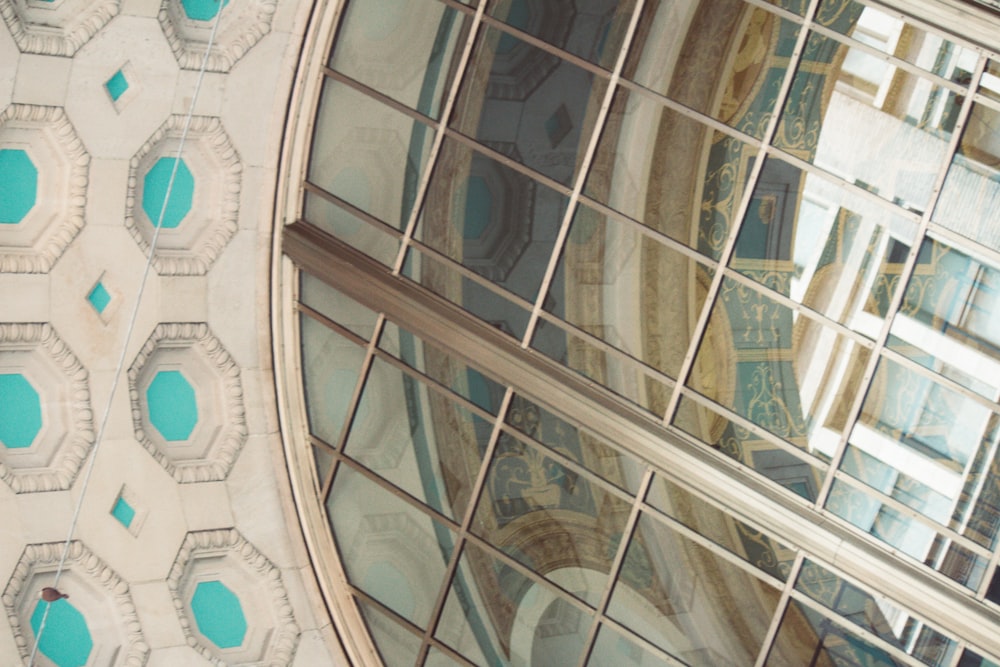 the reflection of a building in the windows of another building