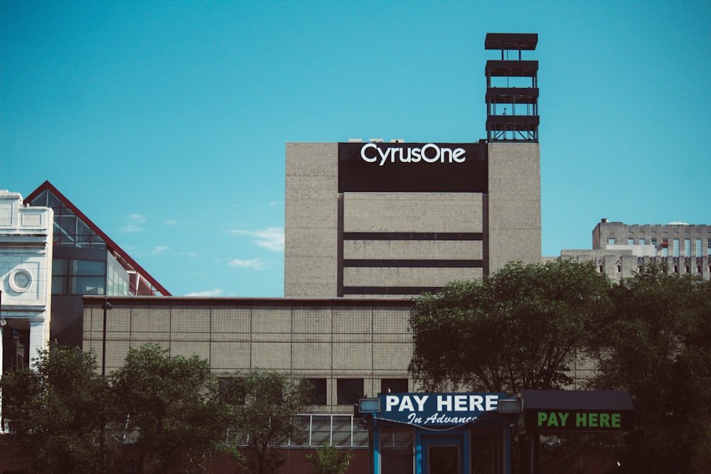 a building with a pay here sign on top of it