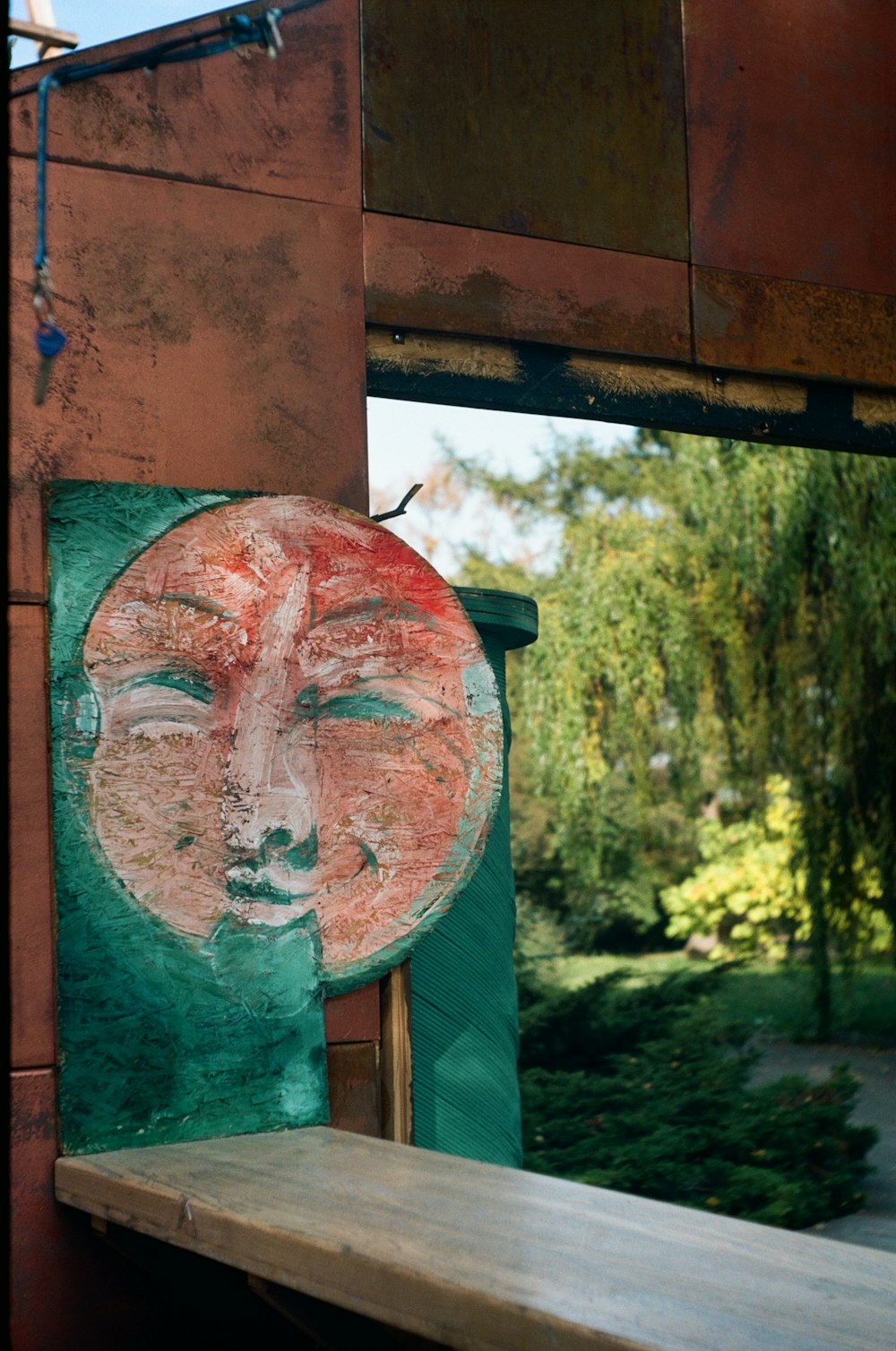 a painting of a woman's face on a wall