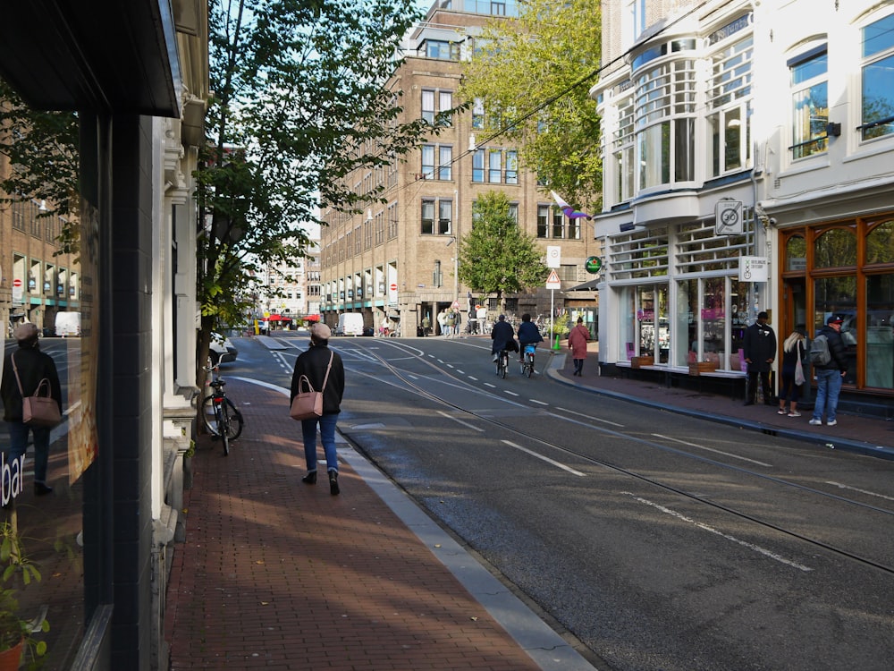 a person walking down a street in a city