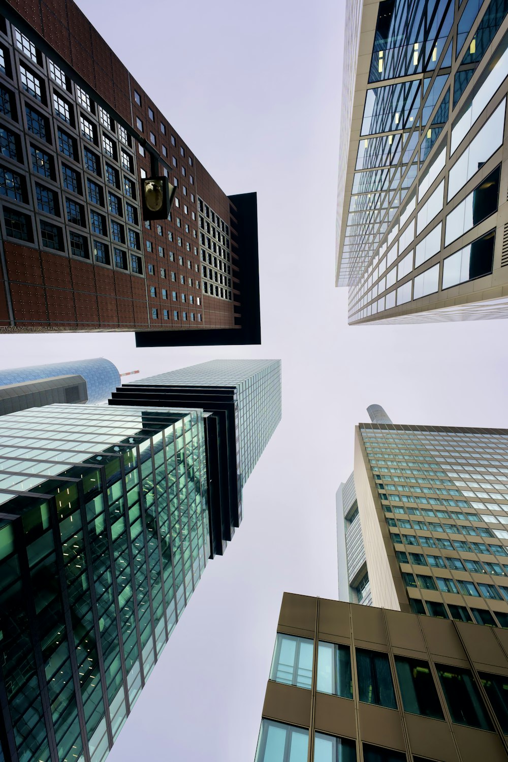 looking up at tall buildings in a city