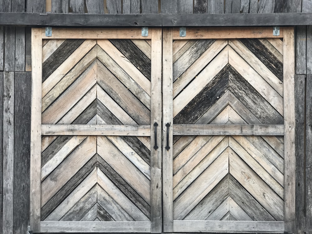 a close up of a wooden door on a building
