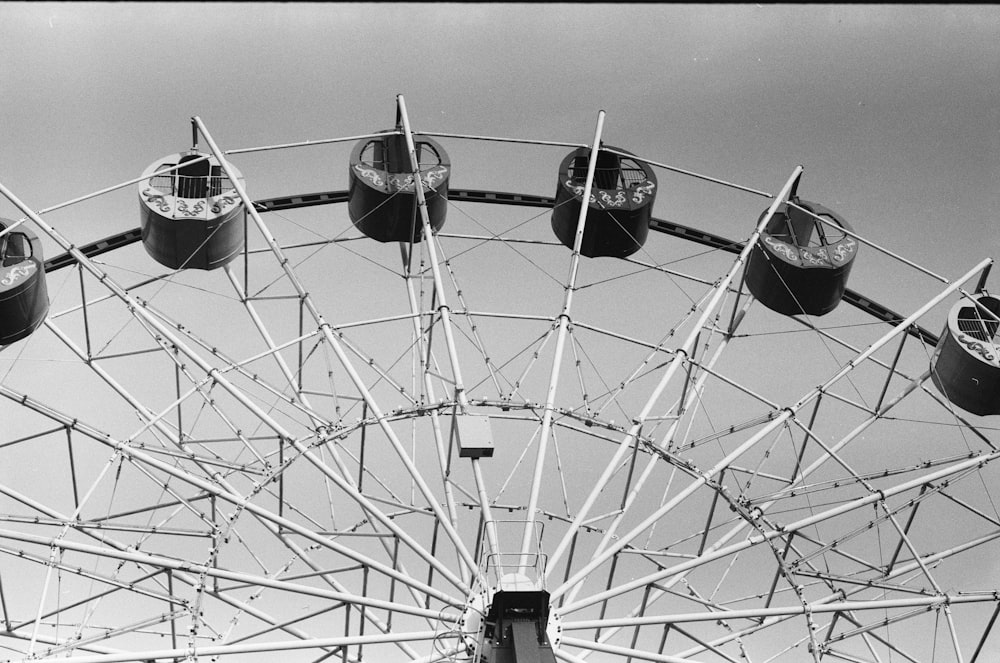 a black and white photo of a ferris wheel