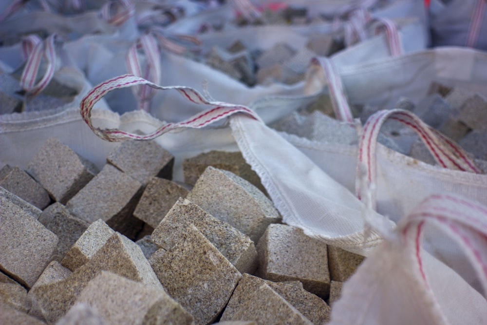 a bag full of cement blocks with a string tied around it