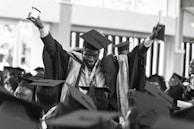A graduation ceremony with students celebrating their success.