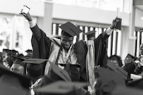 Students happily celebrating their admission approval, holding acceptance letters.