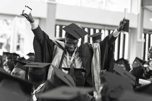 A family celebrating a graduate with hugs and joy.