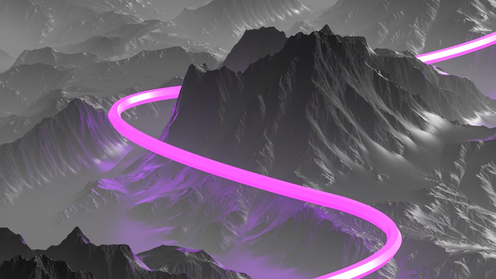 a purple road going through a mountain range