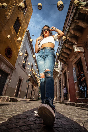 A stylish traveler walking through a historic city street, capturing the essence of exploration.